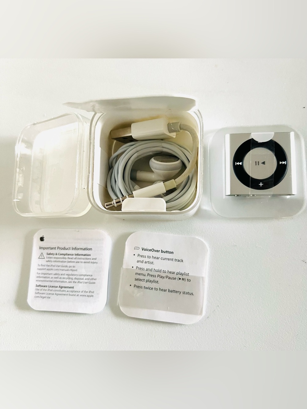 Apple White iPod Shuffle with White Earbuds and USB Cable New Open the Box
